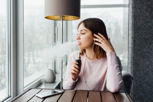 Woman with an E-Cigarette