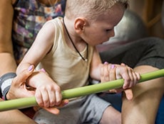 little kid with cerebral palsy has musculoskeletal therapy