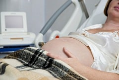 Pregnant Woman in Bed